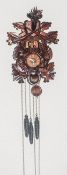 A Black Forest Hand Carved Wooden Automation Cuckoo Clock of good quality with triple weights and