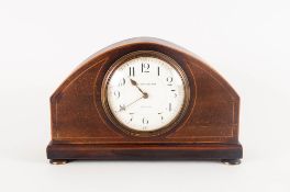 A 1920's Oak Cased 8 Day Mantle Clock raised on 4 circular brass feet with white porcelain dial