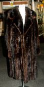 Ladies Three Quarter Length Dark Brown Mink Coat, fully lined. Slit pockets. Collar with revers.