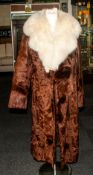 Ladies Full Length Dark Brown Pony Hide Coat with fox fur collar. Fully lined. slit pockets,