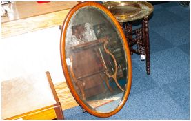 Oval Inlaid Mahogany Framed Edwardian Mirror with bevelled edge.