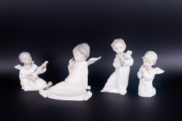 Lladro Angel Figures ( 4 ) In Total. Model Num. 4537 - Black Angel. Model Num. 4540 - Angel with