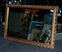 Large Gilt Framed Mirror in The French Style, with ornate moulded edge. 30x48''