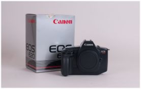 Canon EOS-620 Camera. As new condition with strap. Made 1987-1988. Complete with box and papers.