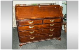 Georgian Mahogany Bureau Circa 1800 finely crossbanded to the flap and drawer fronts. The interior