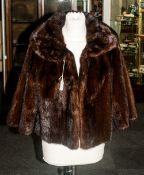 Ladies Dark Brown Mink Jacket, fully lined. collar with revers. slit pockets.