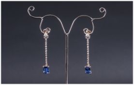 AAA Tanzanite and Diamond Drop Earrings, each earring comprising an octagon cut solitaire of rich