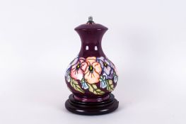 Moorcroft Modern Tubelined Lamp Base Spring Flowers, Maroon Ground. Stands 8'' i height,