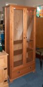 Tall Dark Pine Display Unit, Glazed Front With 2 Glass And 2 Pine Shelves Above Single Drawer To