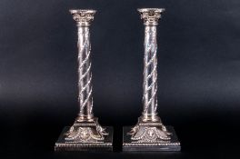 Elkington & Co Very Fine Pair of Silver Plated Candlesticks, Raised on Square Sloped Bases with Rams