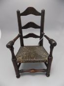 A Late 19th Century Well Made Sample Miniature Lancashire Oak Ladder Back Arm Chair with Rush Seat,