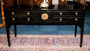 A Modern Highly Polished and Stylish Black Lacquered Sideboard with 4 small drawers to either side