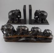 Pair of Carved Ebony Elephant Bookends surmounted by a realistically modelled elephant.