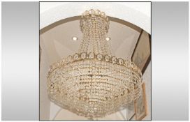 Large Crystal Glass Chandelier of Classical Form on a brass frame,