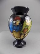 Moorcroft Tubelined Trial Vase 'Dickens People' on blue ground. Designer Paul Hilditch.