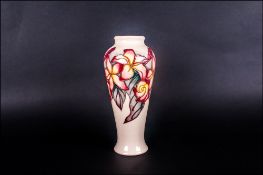 Moorcroft Tubelined Modern Floral Decorated Trial Vase. Date 1999, on cream ground. Stands 8.25