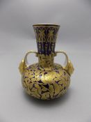 Royal Crown Derby Hand Decorated Twin Mask Handle Vase, Overlaid In Gold on Blue.