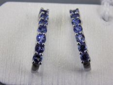 Tanzanite Pair of J-Hoop Earrings, round cut tanzanites totalling 1ct,