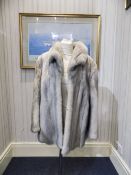 Mink Jacket, fully lined, slit pockets with hook and eye fastening.