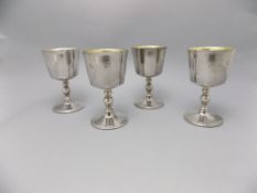 Elizabeth II Fine Set of Four Silver Goblets with Gilt Interiors Raised on Circular Stepped Bases.