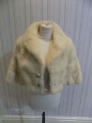 Blonde Mink Shrug. Fully lined with two button fastening to front. No Label to interior.