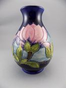Moorcroft Tube Lined Globular Shaped Vase, Magnolia Design on Royal Blue Ground. Signed W.