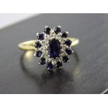 18 Carat Gold Set Diamond and Sapphire Cluster Ring with flower head setting, Fully hallmarked.