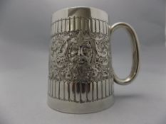 Victorian - Small and Heavy Silver Tankard, with Embossed Mask and Ribbed Decoration.