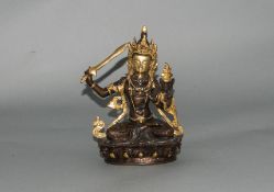 Tibetan - Seated Bronze Deity Holding a Golden Sword In Right Hand with Gold Gilt Decoration to