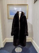 Full Length Dark Brown Beaver Lamb Coat fully lined slit pockets and rever colalr.