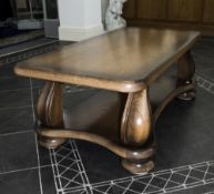 Solid Oak Coffee Table Of Heavy Construction, Rectangular Top On Shaped Supports, Height 20 Inches,