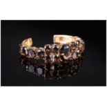 Smoky Quartz Bangle, 67.5cts of the rich dark coffee toned smoky quartz, the central oval cut