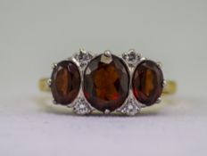 18ct Gold Diamond and Garnet Dress Ring.