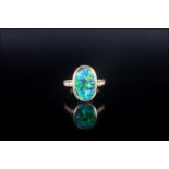 Ladies 18ct Yellow Gold Set Black Opal & DIamond Ring, The oval shaped black opal of good