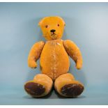 Vintage Well Loved Distressed Large Teddy Bear with jointed arms and legs, with a pointed nose.