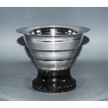 Swedish Art Deco Silver Vase raised on a black lacqurered plinth with tapering and ribbed body.