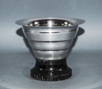 Swedish Art Deco Silver Vase raised on a black lacqurered plinth with tapering and ribbed body.