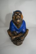 Royal Doulton Early 20thC Monkey Figure wearing a blue night cap and night gown in a sitting