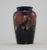 W. Moorcroft Signed Vase ' Pomegranates and Berries ' on Blue Ground. c.1920's. Stands 6.