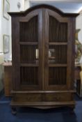 Indonesian Mahogany Cabinet, Arched Form With Spindle Sides And Front Doors,