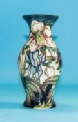 Moorcroft - Fine Tubelined and Shaped Vase ' Ashwood Hellebore ' Design. Designer Nicola Slaney.