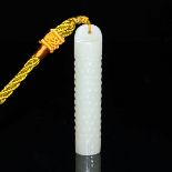 白玉雕谷紋勒子掛墜 A White Jade Lezi Pendant Cylindrical shape and carved with raised bosses, drilled through