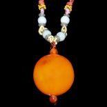 西藏－朝珠圓蜜蠟項飾連珠鏈 Tibetan Beeswax Amber Bead Pendant Necklace. Diameter: 1¼ in (3.2 cm) 
Weight: 29 g.