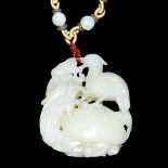 和田玉鏤雕龍龜背鳥掛飾連珠鏈 A Well Carved Hetian Jade Pendant and Necklace with Bird atop Dragon-Tortoise.