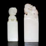 螭龍鈕白玉印料兩件 Two White Jade Qilin Knob Seals Height: 2¼ in (5.7 cm), 2½ in (6.4 cm) Weight: 39 g, 33