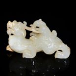 明 白玉雕神獸騎辟邪賞件 Ming, White Jade Carving of a Mythical Beast Riding Qilin The grinning Qilin facing