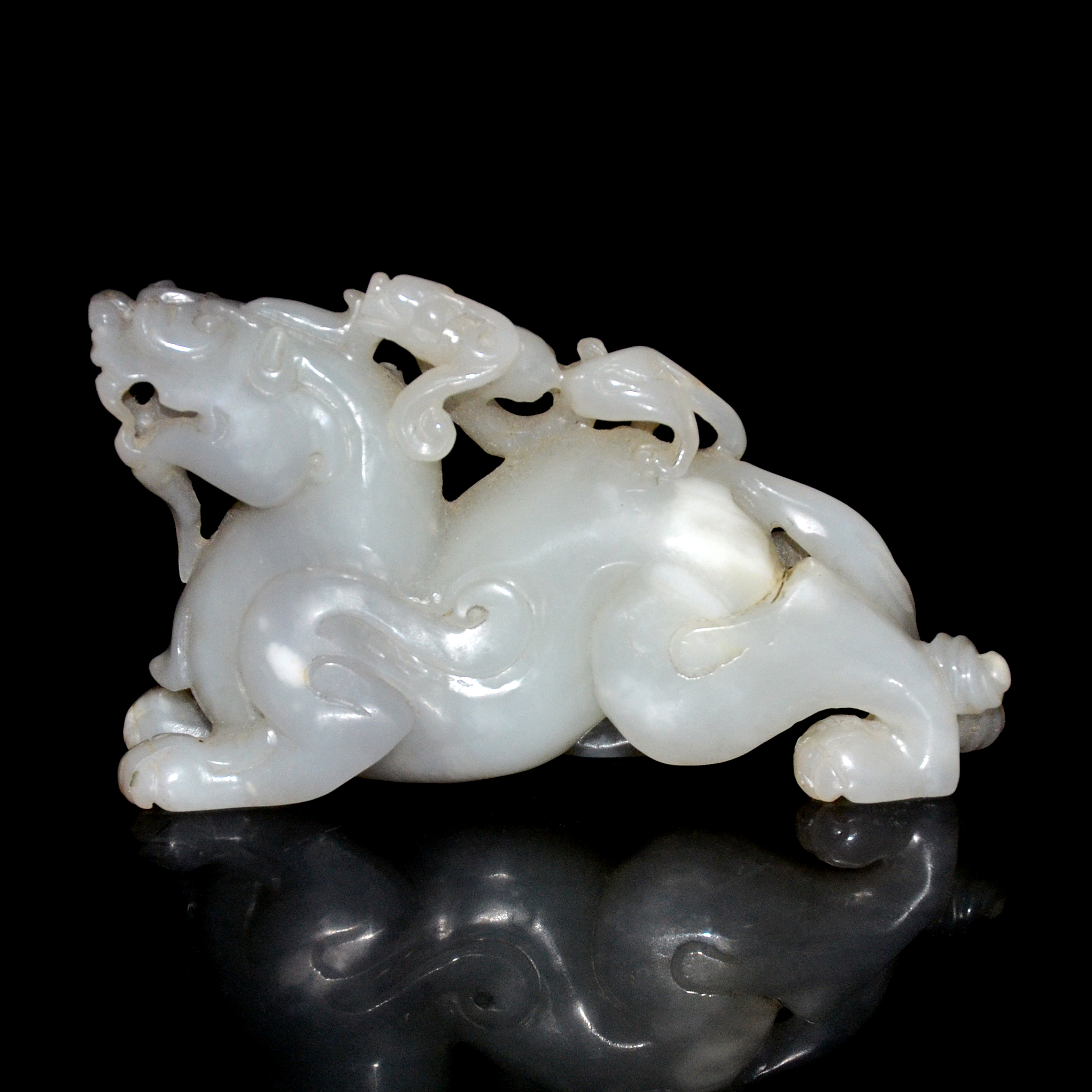 白玉雕螭龍辟邪賞件 Carved White Jade Qilin with Bixie atop Height: 2⅜ in (6 cm) Weight: 246 g