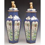 Pair of pottery covered vases in the Wor