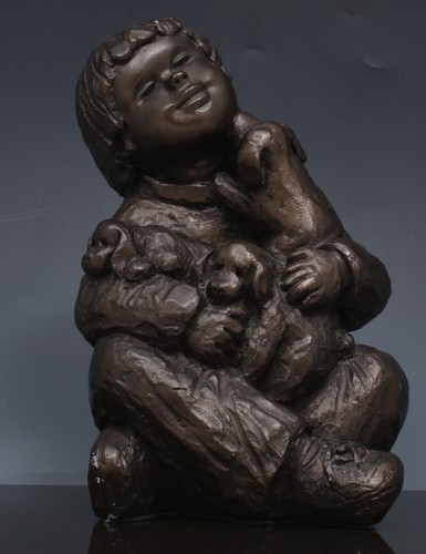 Bronze effect sculpture of a child on a