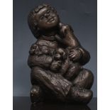 Bronze effect sculpture of a child on a